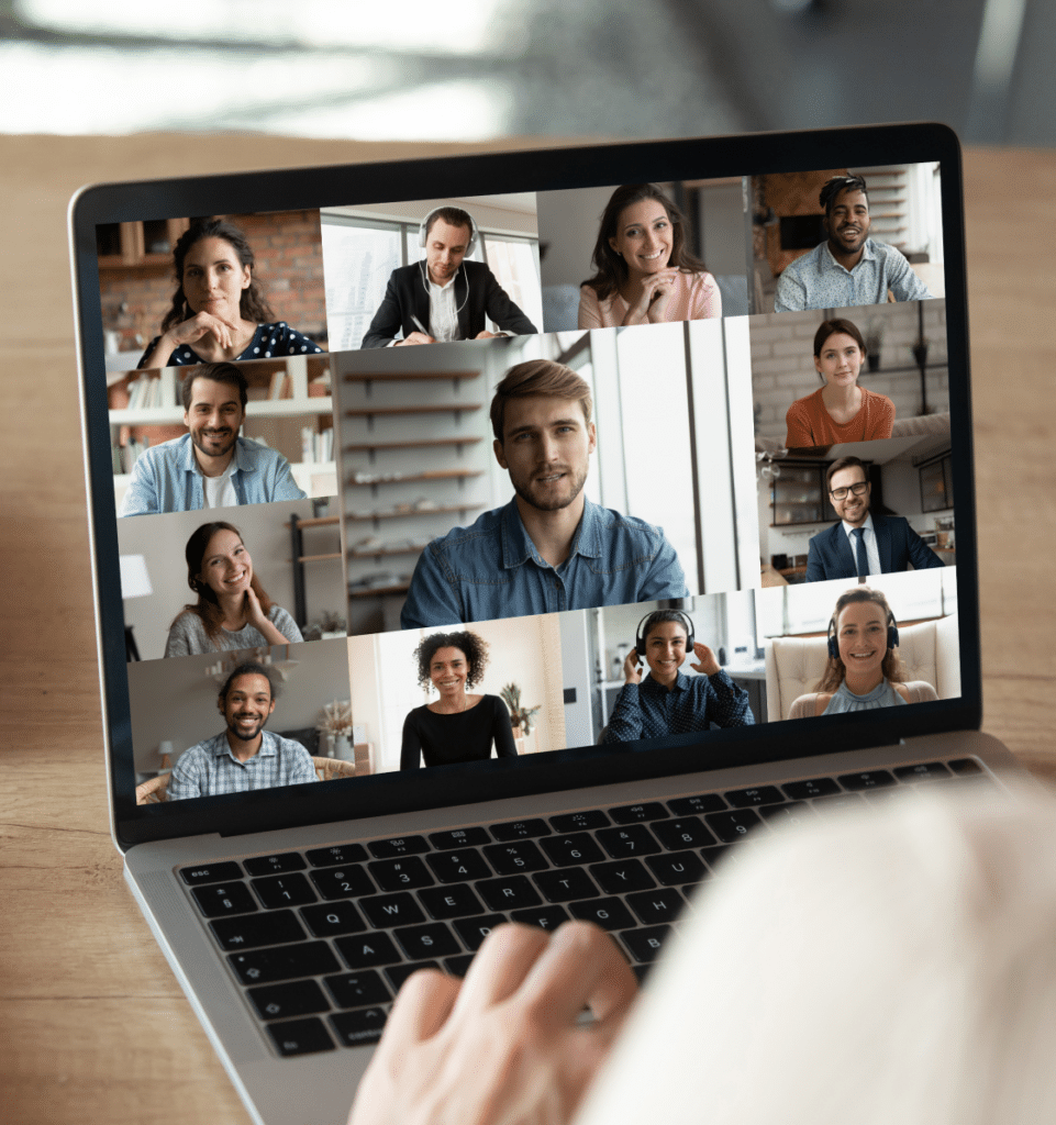 A person participating in a video conference on a laptop during a live online course for Shop Owner Coach.