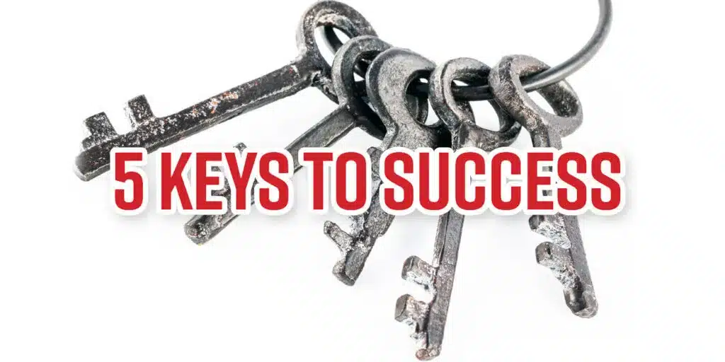 A set of five antique metal keys on a keyring with the bold red text "5 Keys to Success" overlaid, symbolizing essential principles for achieving success.